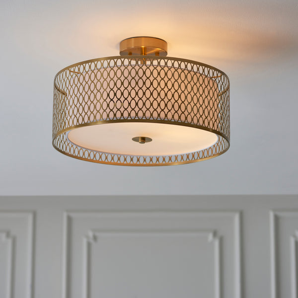 Celestia Gold Filigree Ceiling Light sat flush against a white dining room ceiling