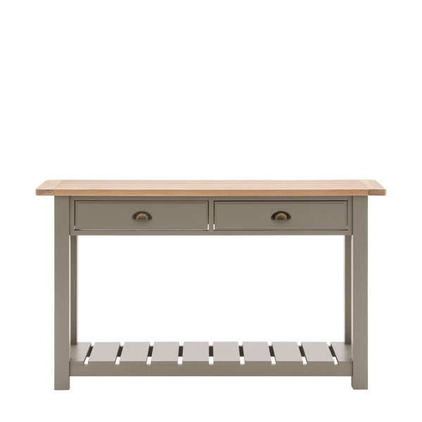 Wooden console table with 2 drawers complimented by a metal drawer pull. Grooved & planked oak top, displaying a lamp and books with a vase sat on top. A slatted bottom shelf space to store baskets, blankets and more. Sat on a plain white background for contrast.