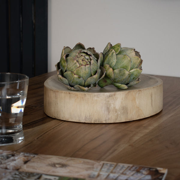 Mango Wood Round Trinket Dish with 2 faux green artichoke styled on top, sat on a wooden kitchen side