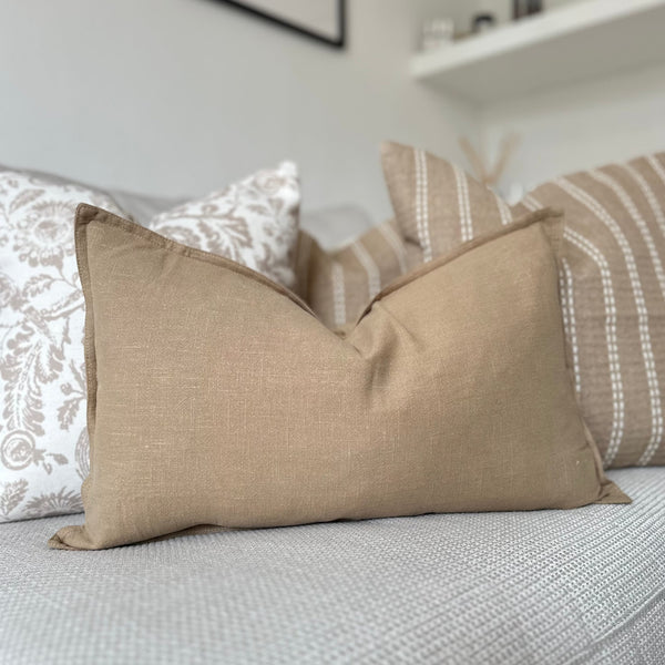 Rectangle Beige Linen Cushion sat on a cream sofa- 50x30cm