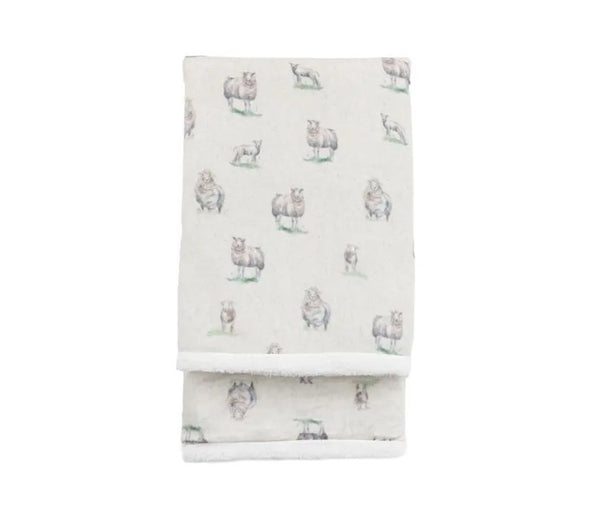 White sherpa blanket with an all over white sheep print